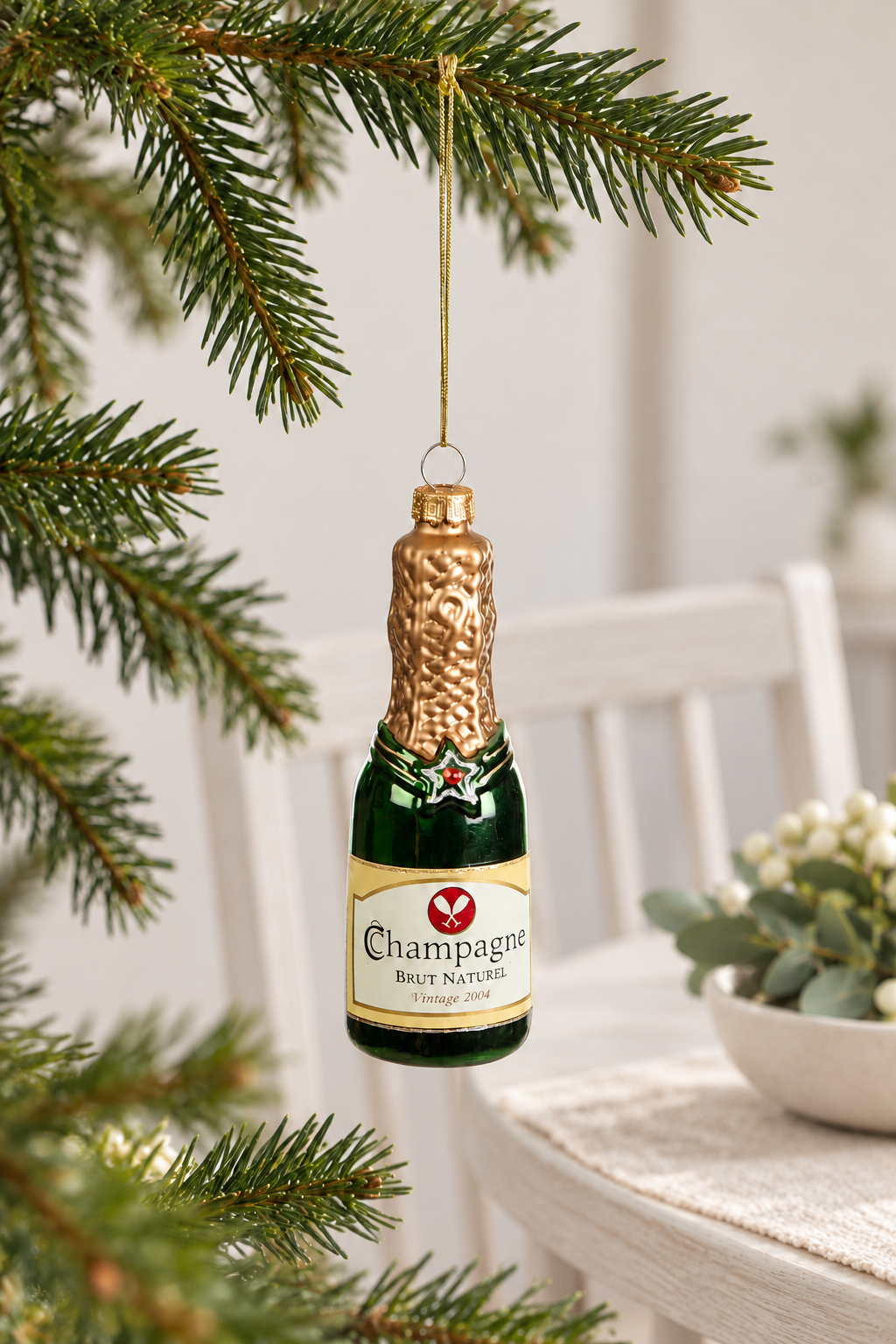 Champagne Bottle Glass Bauble - Green styled indoors with pale whitewashed furniture and summer light; Coast to Coast XX10834