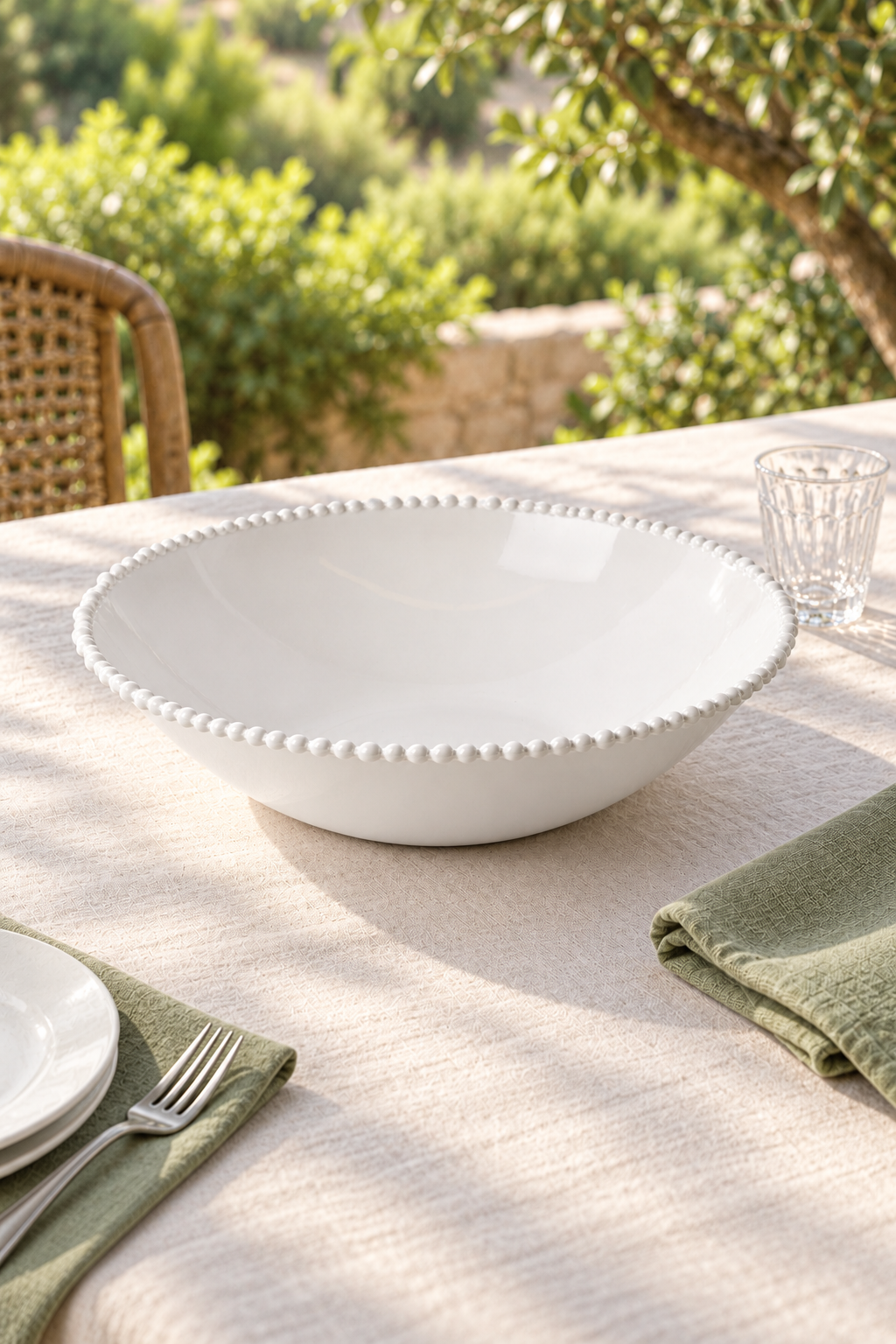 White Pearl Melamine large tapered bowl styled outdoors with green linen