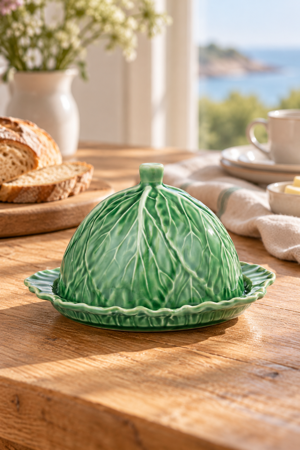 Cabbage Ceramic Cheese and Butter Dome styled in a sunlit coastal home; Coast to Coast KW3235