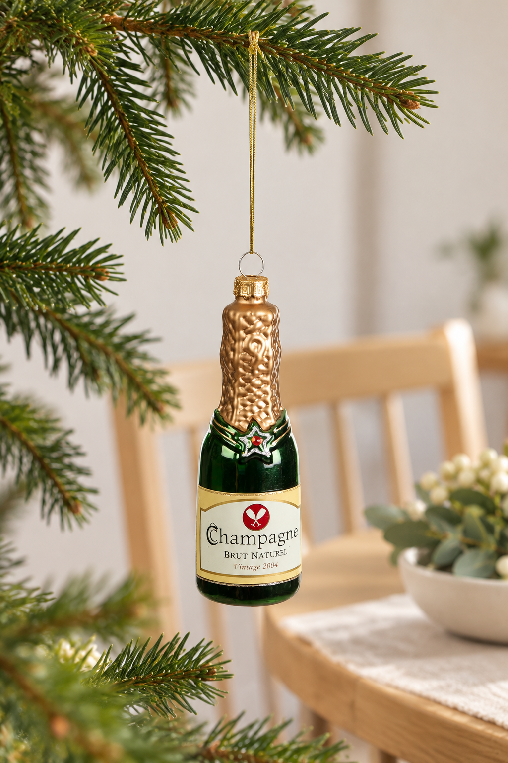 Champagne Bottle Glass Bauble - Green styled indoors in bright summer daylight; Coast to Coast XX10834