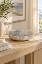 Pebble Cast Resin Bowl styled in a sunlit coastal home; Coast to Coast KW2401