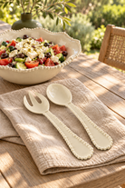 Sand Pearl salad servers with rustic Greek salad outdoors