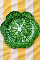 Green Deep Platter – Cabbage Melamine on yellow and white striped tablecloth
