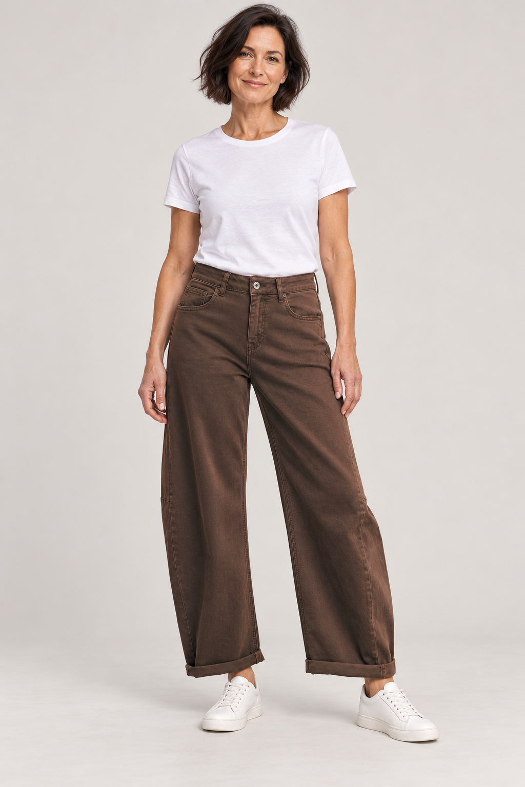 Italian Star Idaho Mocha barrel jeans styled on a brunette model in a studio; AI-styled image