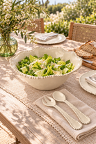 Sand Pearl jumbo salad bowl styled with salad, matching servers and dinner plates