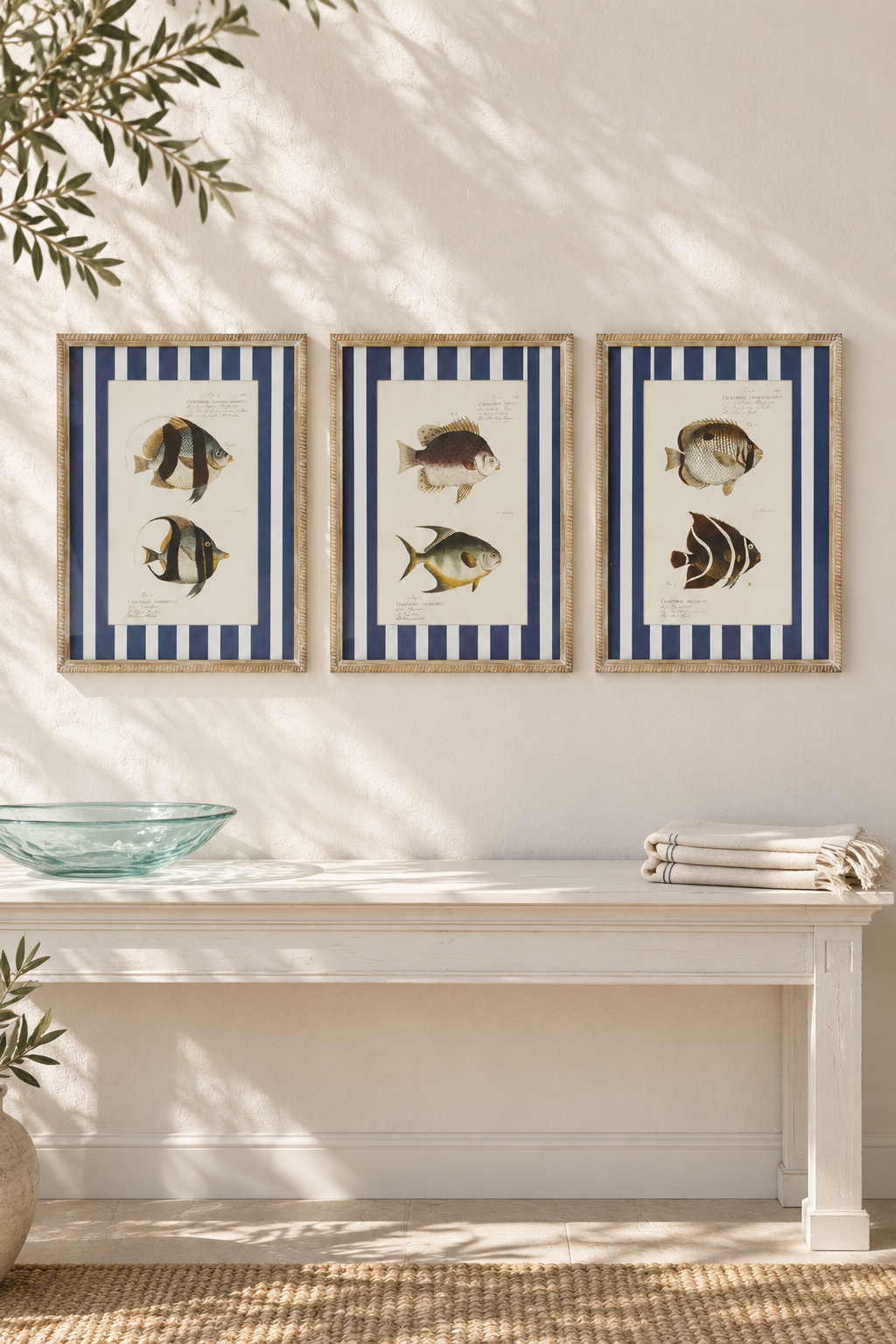 Butterfly, Moorish and Tropical Stripe Fish Studies aligned in a row above a coastal console