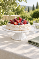 White Pearl Melamine cake stand styled with pavlova and berries outdoors