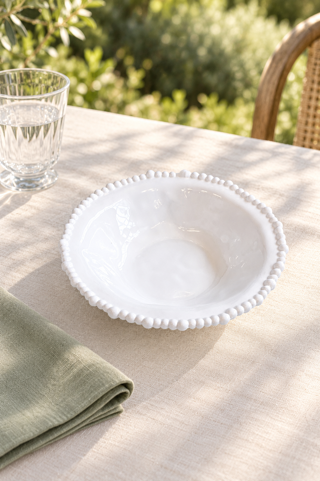 White Pearl Melamine side bowl, empty, styled outdoors with green linen